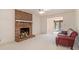 Living room with a brick fireplace and view into adjacent dining room at 201 Vistawood Ln, Marietta, GA 30066