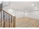 Finished basement with hardwood floors and staircase at 1095 Curry Dr, Atlanta, GA 30319