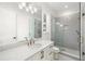 Basement bathroom with gray tile shower and quartz vanity at 1095 Curry Dr, Atlanta, GA 30319