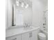 Clean bathroom with white vanity, subway tile, and a large mirror at 1095 Curry Dr, Atlanta, GA 30319