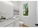 Modern powder room with white vanity and marble countertop at 1095 Curry Dr, Atlanta, GA 30319