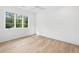 Bright bedroom with hardwood floors and large window at 1095 Curry Dr, Atlanta, GA 30319