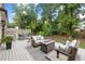 Spacious deck with seating, fire pit, and lush landscaping at 1095 Curry Dr, Atlanta, GA 30319