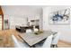 Elegant dining area with a long wooden table and modern white chairs at 1095 Curry Dr, Atlanta, GA 30319