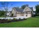 Brick home with three-car garage and manicured lawn at 1095 Curry Dr, Atlanta, GA 30319