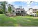 Home's exterior showcasing a large backyard and elevated deck at 1095 Curry Dr, Atlanta, GA 30319