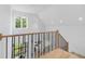 Modern staircase with light wood and black metal accents at 1095 Curry Dr, Atlanta, GA 30319