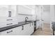 Modern wet bar with white cabinets and black countertop at 1095 Curry Dr, Atlanta, GA 30319