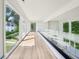 Hallway with floor to ceiling windows and hardwood floors at 825 Kenry Ct, Atlanta, GA 30342
