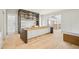 Spacious kitchen featuring a large island, custom cabinetry, and a bright, open design at 825 Kenry Ct, Atlanta, GA 30342