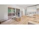 Bright, open kitchen with access to a screened porch through sliding glass doors and custom cabinets at 825 Kenry Ct, Atlanta, GA 30342