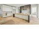 Unfinished kitchen space with white cabinets, a spacious island and hardwood floors at 825 Kenry Ct, Atlanta, GA 30342
