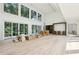 Spacious living room with high ceilings, light wood floors and oversized glass doors offering lots of natural light at 825 Kenry Ct, Atlanta, GA 30342