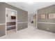 Hallway with access to other rooms and neutral wall paint at 2361 Georgia Ln, Snellville, GA 30078