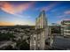 Stunning aerial view of a modern building against a colorful sunset sky at 3324 Peachtree Ne Rd # 2718, Atlanta, GA 30326