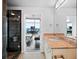 Modern bathroom featuring a granite vanity, sleek mirror, and a walk-in shower with black tile surround at 3324 Peachtree Ne Rd # 2718, Atlanta, GA 30326