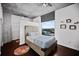 Bedroom with hardwood floors, concrete ceiling, and a city view at 3324 Peachtree Ne Rd # 2718, Atlanta, GA 30326