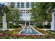 Attractive building entrance with fountain and beautiful landscaping at 3324 Peachtree Ne Rd # 2718, Atlanta, GA 30326