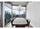 Bright dining room with modern chandelier, dining table and beautiful city views at 3324 Peachtree Ne Rd # 2718, Atlanta, GA 30326