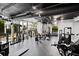 Bright gym with weight machines, large windows, and industrial-style ductwork at 3324 Peachtree Ne Rd # 2718, Atlanta, GA 30326
