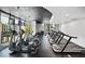 Well-equipped gym with treadmills, elliptical machines, and large windows at 3324 Peachtree Ne Rd # 2718, Atlanta, GA 30326