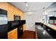 Modern kitchen with stainless steel appliances, black backsplash, and granite countertop at 3324 Peachtree Ne Rd # 2718, Atlanta, GA 30326