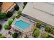 Aerial view of a beautiful community pool with lounge chairs and landscaped seating areas at 3324 Peachtree Ne Rd # 2718, Atlanta, GA 30326