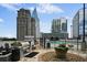 Outdoor pool area with barbecue and city views at 3324 Peachtree Ne Rd # 2718, Atlanta, GA 30326