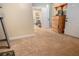 Basement featuring carpet flooring, a storage closet, and access to a naturally lit office space at 104 Streambank Ct, Temple, GA 30179