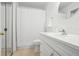 Clean bathroom with white vanity, shower, and tile floor at 609 Mill Pond Se Dr, Smyrna, GA 30082