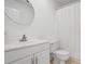 Simple bathroom with white vanity, shower/tub combo, and toilet at 609 Mill Pond Se Dr, Smyrna, GA 30082