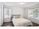 Well-lit bedroom featuring wood floors and ample natural light at 609 Mill Pond Se Dr, Smyrna, GA 30082