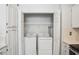 In-unit laundry closet with washer and dryer at 609 Mill Pond Se Dr, Smyrna, GA 30082