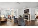 Comfortable living room featuring a fireplace, neutral paint, and wood flooring throughout the space at 609 Mill Pond Se Dr, Smyrna, GA 30082