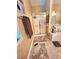 The bathroom includes a shower with glass doors, bathtub, and light brown floor mat at 6561 Harrington Pl, Douglasville, GA 30135