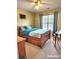Bright bedroom featuring a wooden bed frame with storage drawers and window at 6561 Harrington Pl, Douglasville, GA 30135