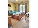 Bedroom with window and natural light, wood bed frame and simple decor at 6561 Harrington Pl, Douglasville, GA 30135