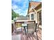 Outdoor deck with a table and chairs, perfect for relaxation and entertainment at 6561 Harrington Pl, Douglasville, GA 30135