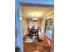 Inviting dining room featuring wood floors, decorative rug, and chandelier lighting at 6561 Harrington Pl, Douglasville, GA 30135