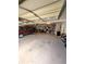 Spacious garage with ample storage shelving, a car and overhead door at 6561 Harrington Pl, Douglasville, GA 30135