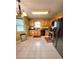 Functional kitchen with oak cabinets and black appliances at 6561 Harrington Pl, Douglasville, GA 30135