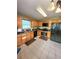 Well-lit kitchen featuring wooden cabinets and modern black appliances at 6561 Harrington Pl, Douglasville, GA 30135