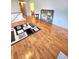 Bright living room with hardwood floors is the perfect place to gather with friends at 6561 Harrington Pl, Douglasville, GA 30135