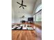 Open living room featuring a fireplace, large windows, and hardwood flooring at 6561 Harrington Pl, Douglasville, GA 30135