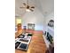 Bright living room with vaulted ceiling, fireplace, and beautiful hardwood floors at 6561 Harrington Pl, Douglasville, GA 30135