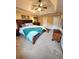 The main bedroom has a tray ceiling, a large bed, and a decorative area rug at 6561 Harrington Pl, Douglasville, GA 30135