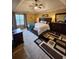 The main bedroom has a tray ceiling, a large bed, and a decorative area rug at 6561 Harrington Pl, Douglasville, GA 30135