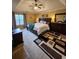 The main bedroom has a tray ceiling, a large bed, and a decorative area rug at 6561 Harrington Pl, Douglasville, GA 30135