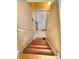 Wooden staircase leads down into the home and has a landing with doors at 6561 Harrington Pl, Douglasville, GA 30135