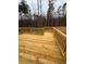 Spacious deck overlooks wooded backyard; perfect for entertaining at 3730 Reserve Overlook (Lot 8) Way, Cumming, GA 30041